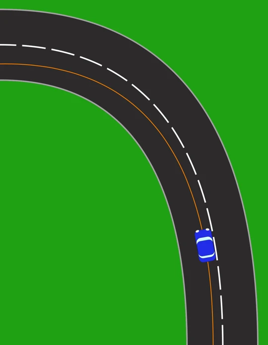 A left-hand bend seen from above. The car stays within its own lane but sits towards the centre line, following a curved path that keeps it away from the inside of the bend so more of the road round the corner comes into view.