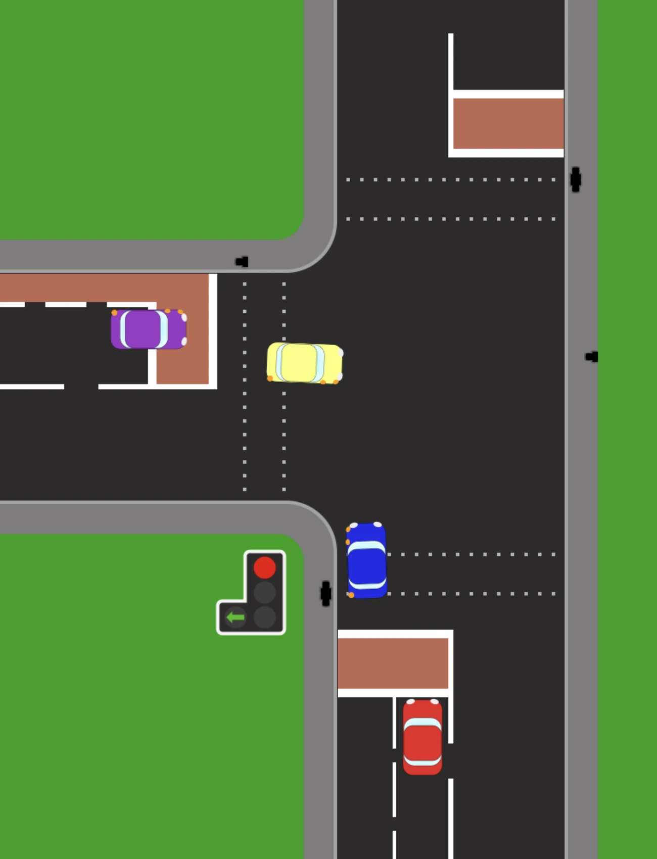 A light-controlled junction from above. The signal on the corner shows red with a green left filter arrow lit beside it, so traffic turning left may go while everything else waits. A blue car is at the line and a yellow car crosses ahead of it.